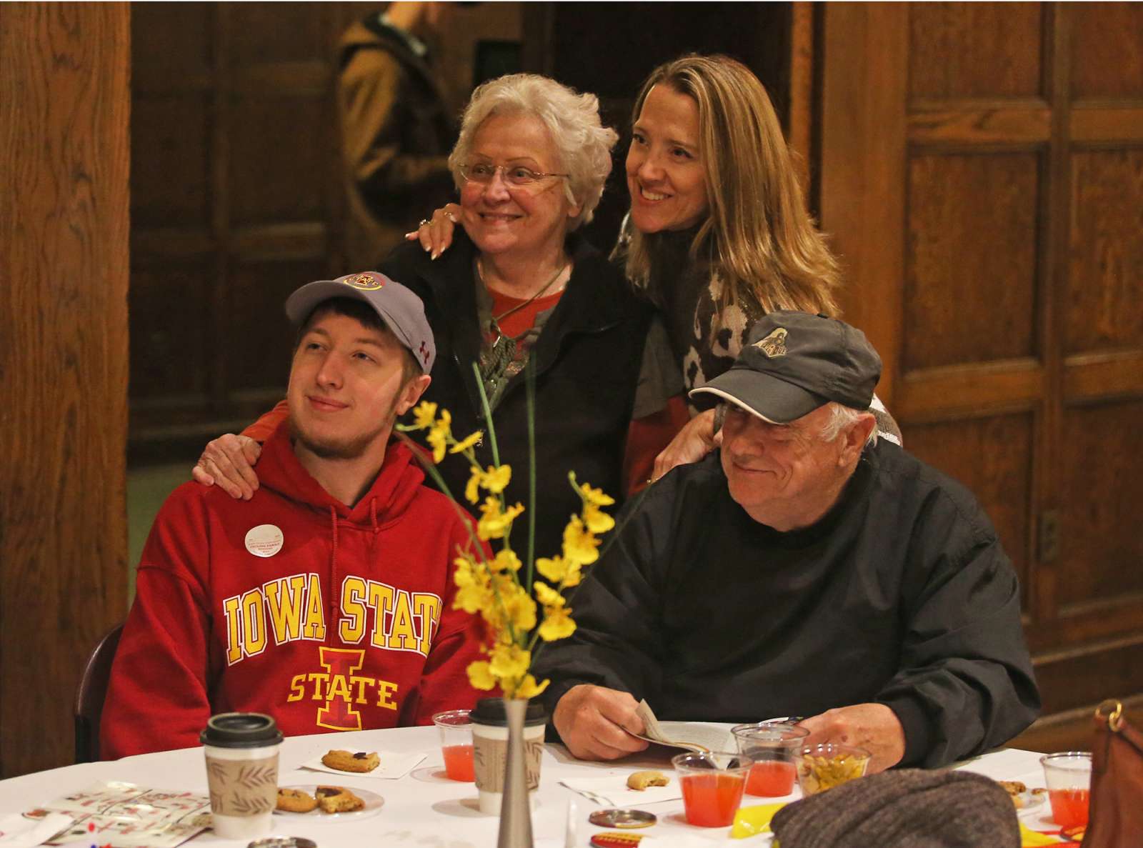 Family posing for photo at Cyclone Family Weekend Reception